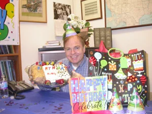 Rusty poses with his low-carb cakes on his birthday