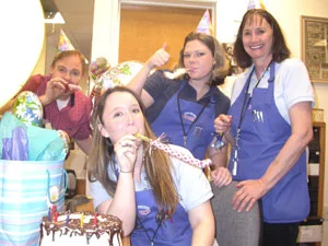 Amy, Marie, and Rusty, celebrate Maya’s birthday at the coin shop