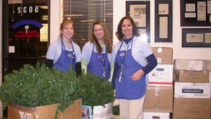 Southgate girls pose in front of the boxed Christmas tree