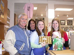 Southgate Coins client Otto brings Swiss chocolates and Christmas presents to the coin shop