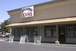 The paint is on the walls at the coin shop