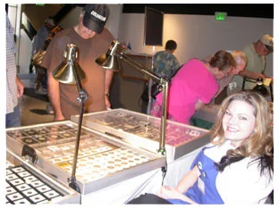 Southgate Coins employee Amy mans the sales booth
