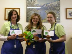 Southgate Coins employees wearing green on St. Patrick’s Day