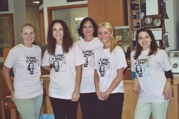 Southgate Coins staffers in their Flipping is Sweet company T-shirts