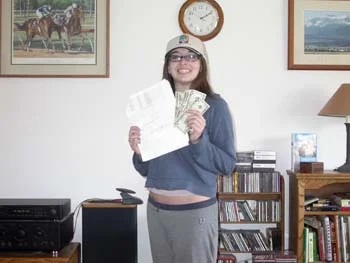 Southgate Coins employee somer with her winning horse race bet