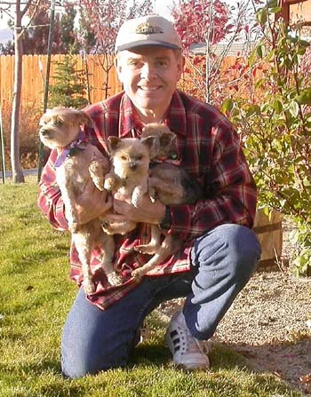 Southgate Coins owner Rusty Goe with the puppies
