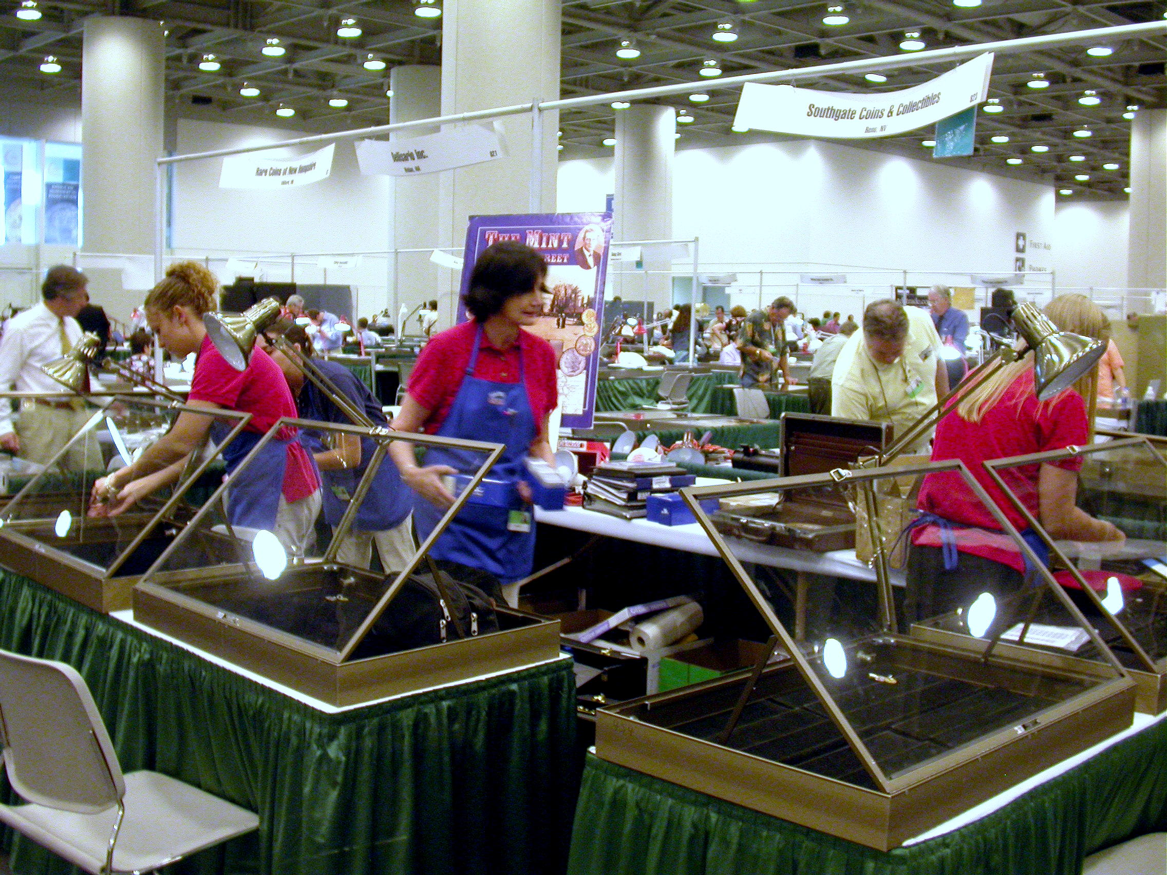 Southgate Coins owner Marie and her employees set up the booth at the 2005 Summer ANA