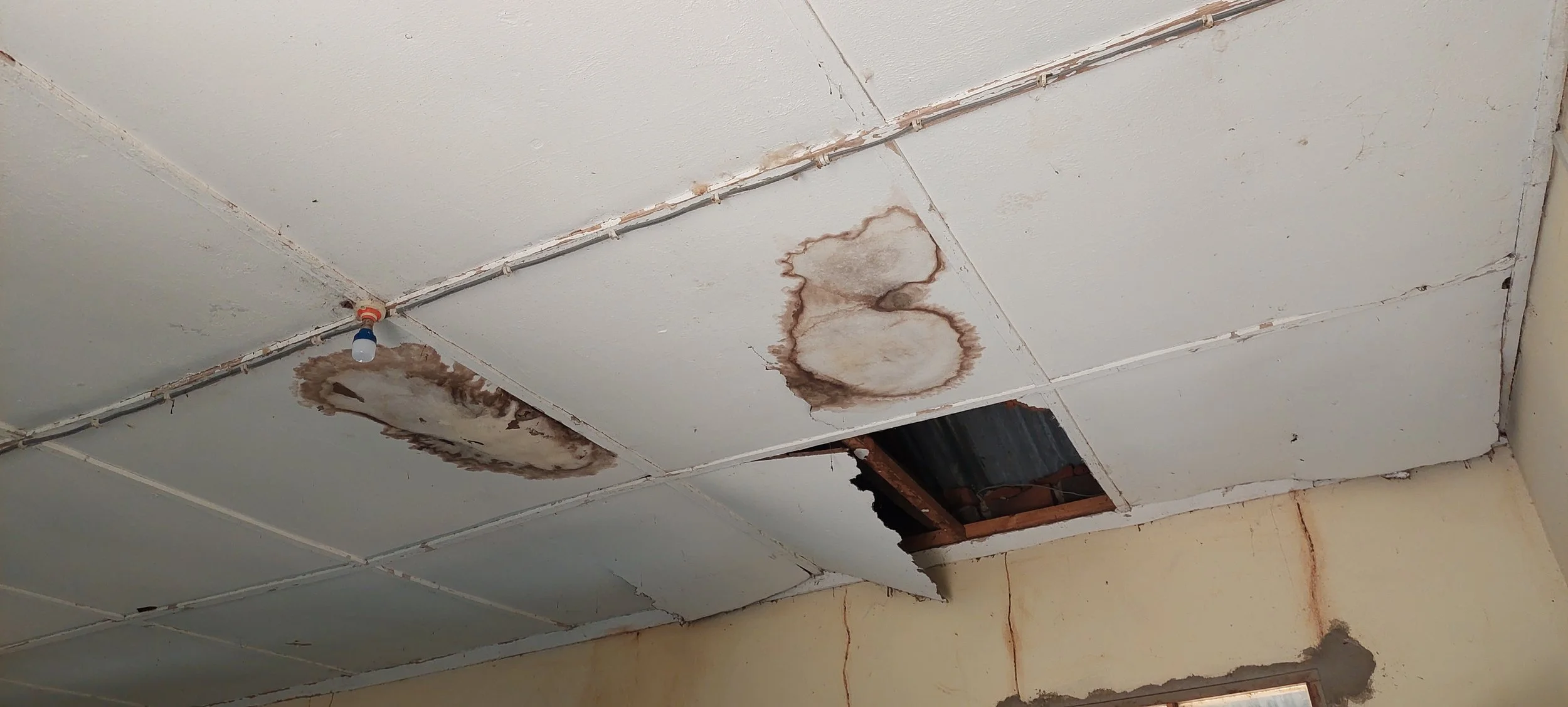 Damaged ceilings before roof repairs