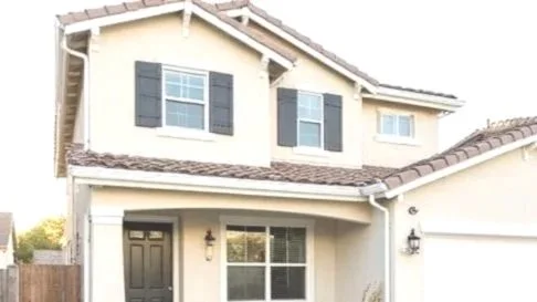 Realistic suburban home in Santa Clarita California with newly installed white vinyl windows, clean exterior, bright natural sunlight, modern but natural look, no people, high detail, professional photography style.jpg