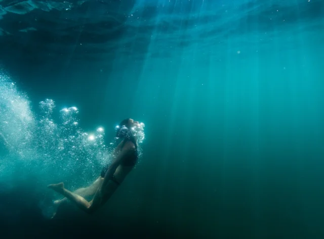 Diving Deep in Elk Lake, Oregon, photo by Tyler Roemer