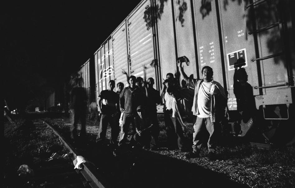   Spending the night on the tracks. The train has no schedule so migrants need to be ready for the its departure at any point.    Arriaga, Chiapas, Mexico. 2007     