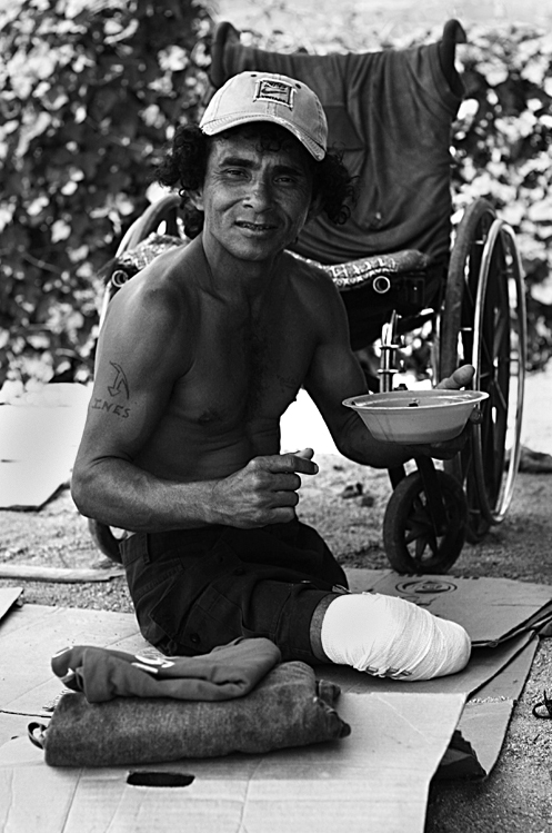   “I lost both of my legs when the train derailed…” For several decades, the cargo train has left a river of handicapped people who lose their limbs upon falling off the train.    Ciudad Ixtepec, Oaxaca, Mexico. 2007     