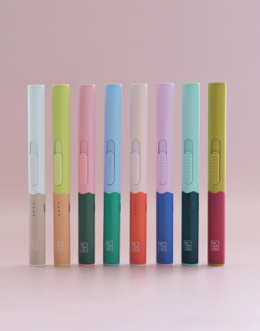 Collection of colorful rechargeable lighters in various modern colorways for candle enthusiasts.