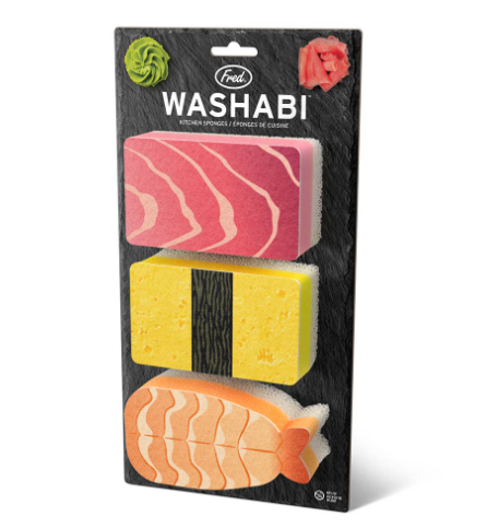 The retail packaging for the Washabi Sponges Set of 3 by Fred & Friends, featuring tuna, tamago, and shrimp designs mounted on a slate-style backing card.
