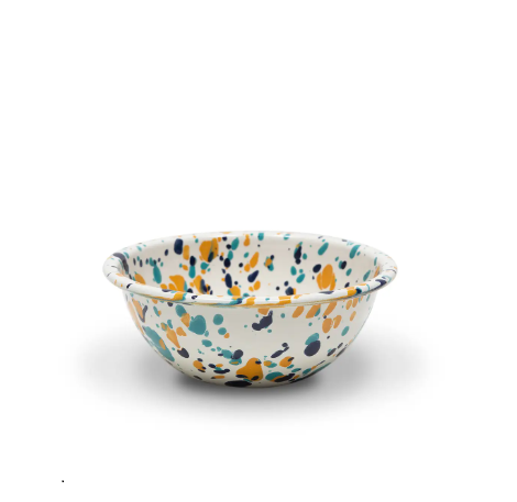 Catalina Cereal Bowl in Bermuda Buttercup, showcasing its unique enamel splatter design and smooth, curved shape.