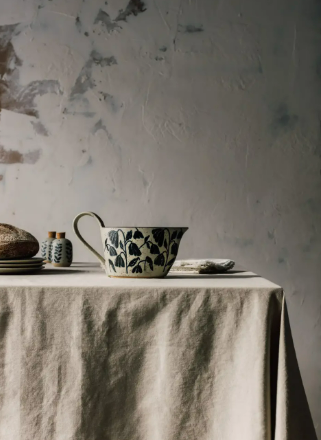 Minimalist element-inspired gravy boat with a 24 oz capacity for holiday sauces and dinner parties.