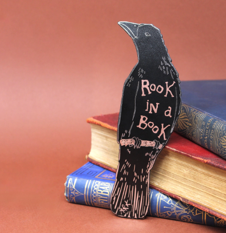 Showcase your favorite reads with the unique Rook in A Book leather bookmark by Ark Colour Design, complete with metallic foil accents.