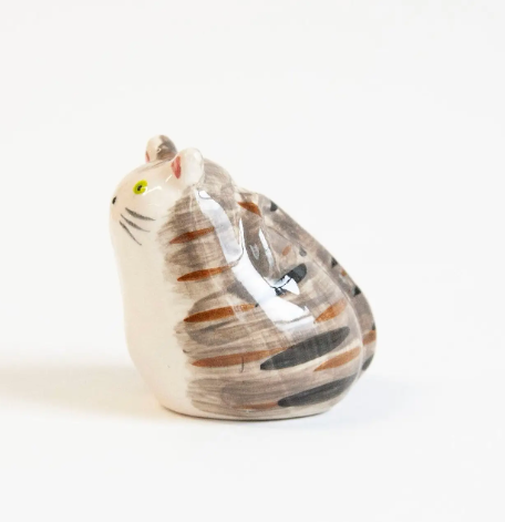 Side profile of the tabby cat decorative object by Co.House Designs displaying its hand-painted stripes and glazed surface.