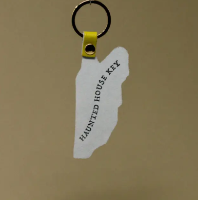 Highlight the clever 'Haunted House Key' embossing on the reverse of the Ark Colour Design Leather Spoo-Key Ghost Key Ring.