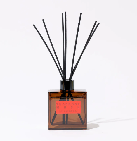 Showcase your interior style with the Tuberose Musk Hi-Fi Reed Diffuser by P.F. Candle Co., featuring naturally-harvested black rattan reeds fanned out in a cocoa brown glass bottle.