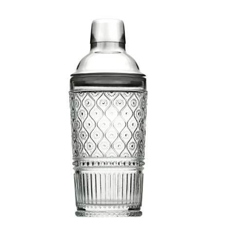 The Claro Cocktail Shaker by Godinger in clear crystal, featuring ornate Victorian embossing and a stainless steel lid.
