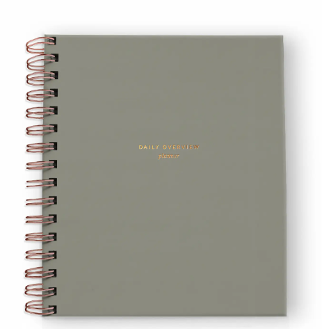 A calming light sage daily planner with elegant gold foil detailing, promoting intentional living and mindful planning.