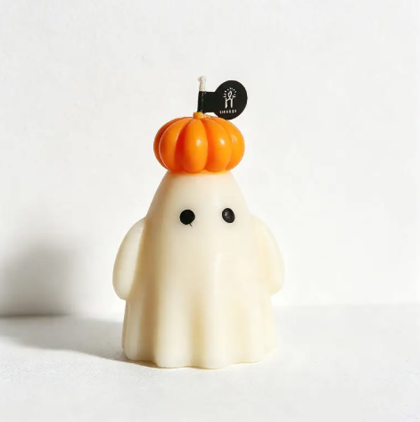 Bring whimsical charm to your autumn decor with the Ghost Pumpkin Candle Style 2 by CouldNook, featuring a friendly ghost wearing a tiny pumpkin cap.