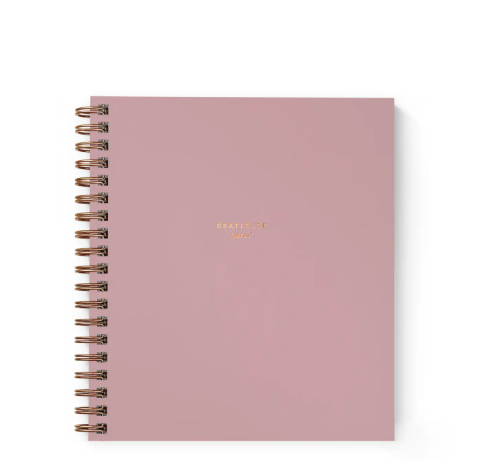 A beautiful dusty rose gratitude journal with elegant gold foil detailing, encouraging daily reflection and thankfulness.