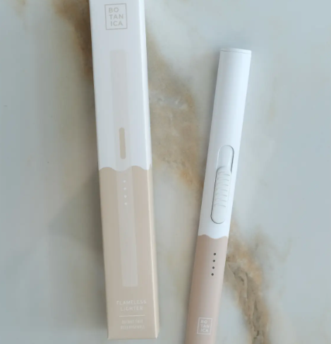 A sleek White + Taupe duo-tone flameless lighter and its matching packaging.