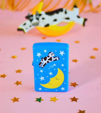Cow Over The Moon Lighter by The Peach Fuzz, showcasing the unique design and refillable feature.