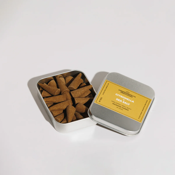 Citronella + Sea Salt Incense Cones by Commonwealth Provisions: The tin packaging displayed alongside the incense cones, perfect for any outdoor setting.