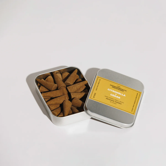Citronella + Cedar Incense Cones by Commonwealth Provisions: The tin packaging displayed alongside the incense cones, perfect for any outdoor setting.