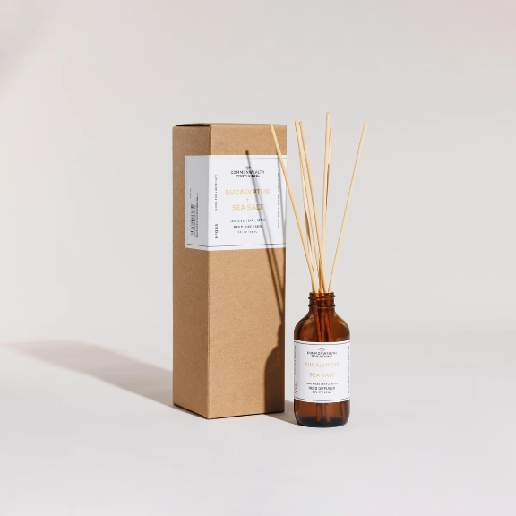 Close-up of the Eucalyptus + Sea Salt Reed Diffuser showing the reeds and fragrance oil.