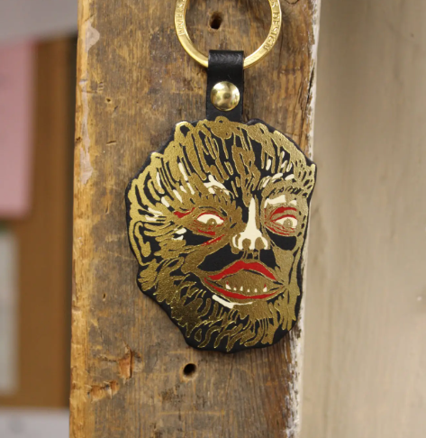 Add a touch of mythic personality to your everyday essentials with the gold-foiled Leather Werewolf Key Ring by Ark Colour Design.