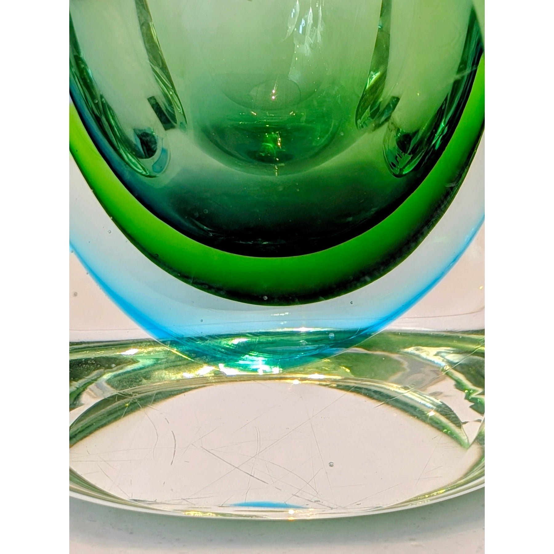 Close-up of green-to-blue sommerso glass layers on vintage Murano vase
