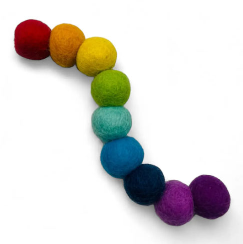 Koira's Woolly Worm Cat Toy is a colorful, connected felt ball kicker that encourages active and engaging playtime for your cat.