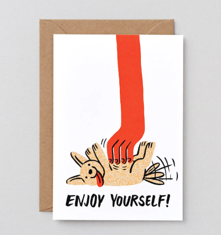 An illustrated greetings card featuring a large red hand vigorously rubbing the belly of a happy dog lying on its back, with the text "ENJOY YOURSELF!" below.