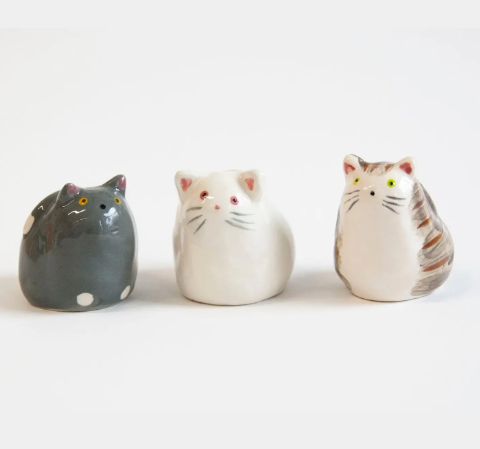 The full set of three hand-painted stoneware cat figures by Co.House Designs featuring grey, white, and tabby styles lined up together.