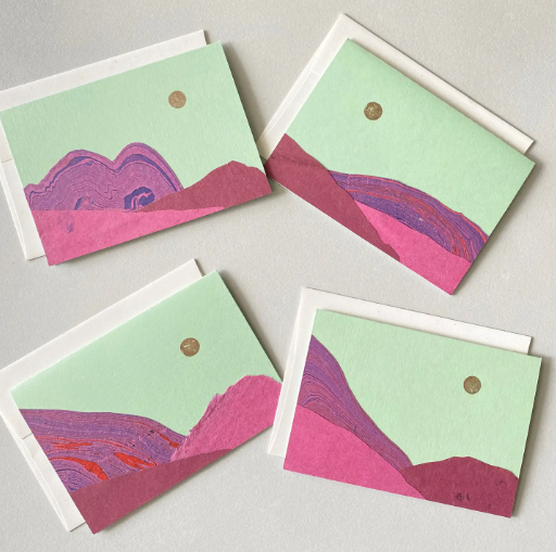 Display of unique, handmade cards showing the variations in the marbled paper "purple mountains on mint" design.