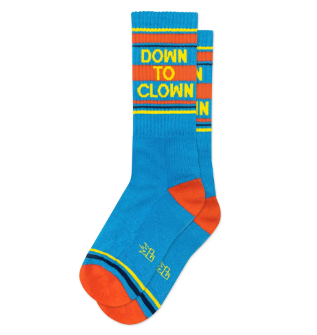 A pair of bright blue crew socks with orange and yellow stripes and the phrase DOWN TO CLOWN knit into the top in bold yellow letters.