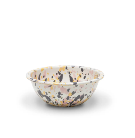 Catalina Cereal Bowl in Pink Sunset, showcasing its unique enamel splatter design and smooth, curved shape.
