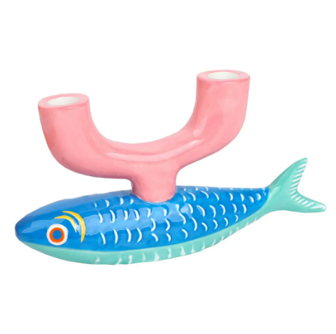 A whimsical blue and pink ceramic fish candle holder from the Bon Appetit collection, perfect for a coastal centerpiece.