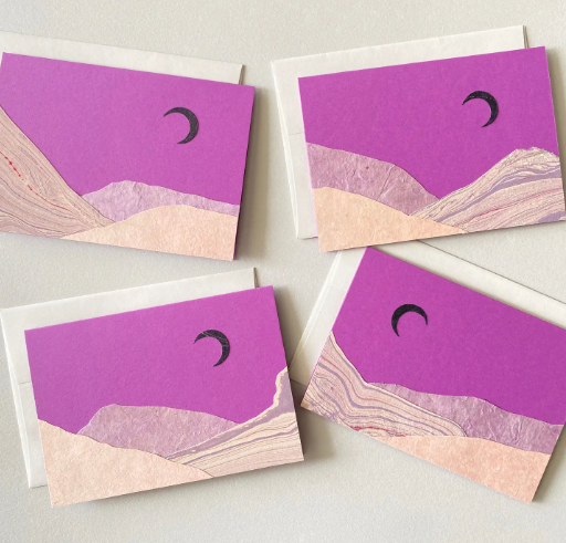 Display of unique, handmade cards showcasing variations in the marbled paper "purple haze black moon" design.