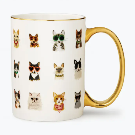 An illustrated mug titled Cool Cats showing various cats wearing sunglasses and bows with a metallic gold rim.