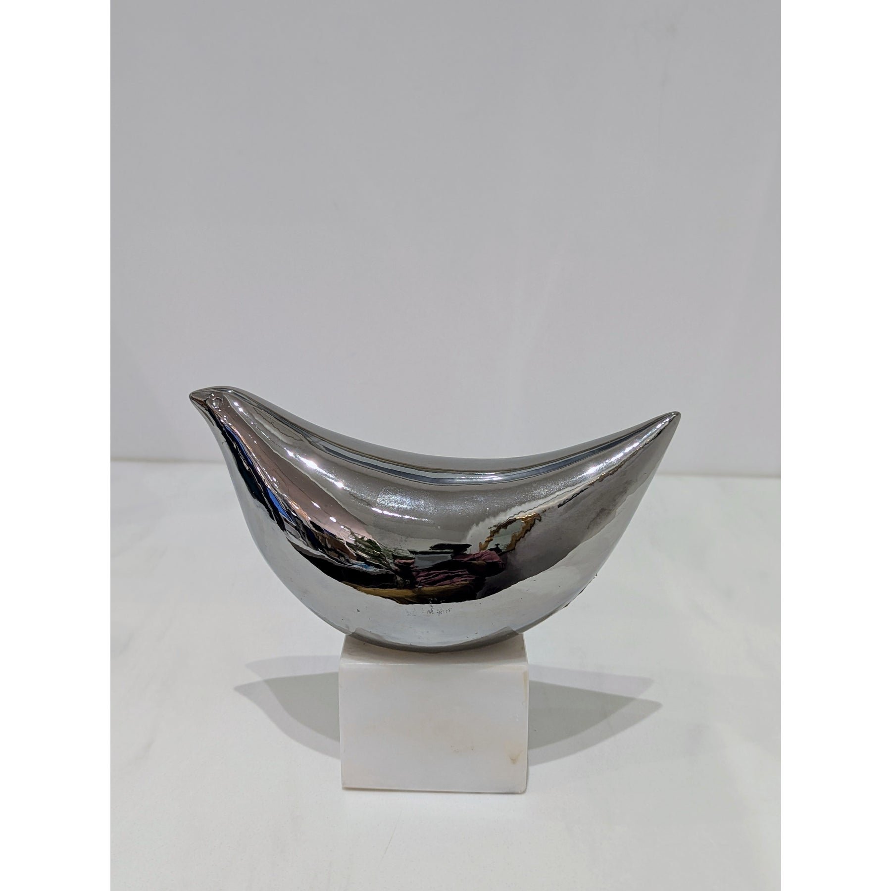 raymor-silver-ceramic-bird-sculpture-on-white-marble-base-7727.jpeg