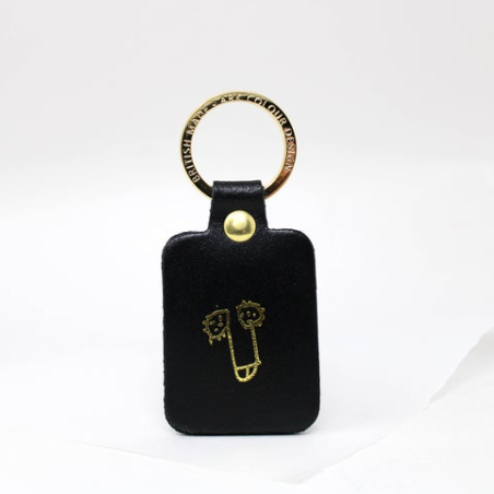 Black leather willy keyring with a gold-plated ring, a humorous and high-quality novelty keychain.