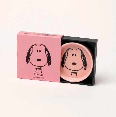 The Snoopy Visage pin dish packaged in its slide-out pink and black gift box, showcasing the elegant presentation.