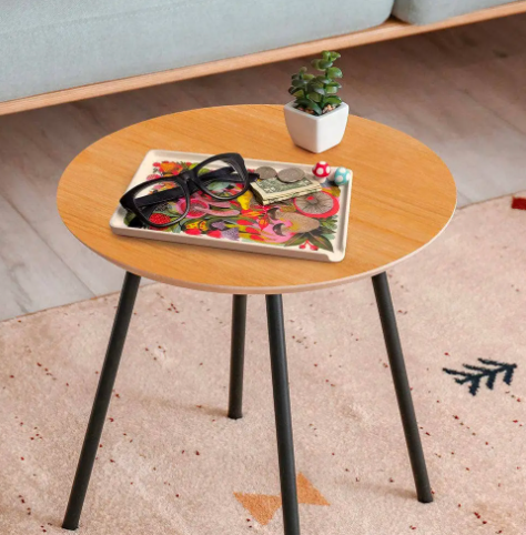 Whimsical artist-designed catch-all tray for home organization, made of durable melamine with a vibrant nature-inspired pattern.