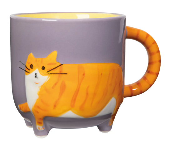 Showcase the lavender Ginger Cat Critter Mug by Danica Jubilee, complete with a striped orange cat wrapping around the stoneware body and handle.
