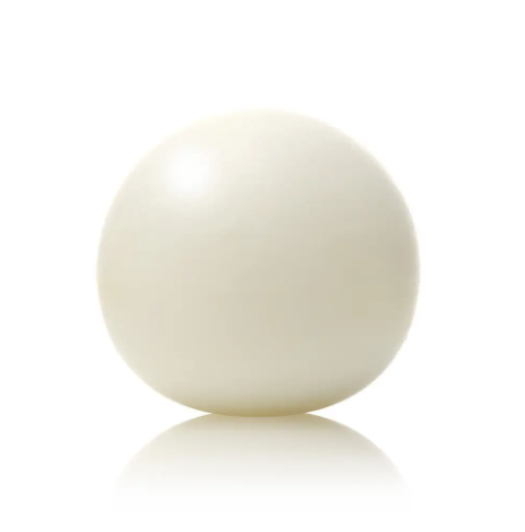 Smooth and spherical Tamanohada round soap by Ameico resting against a clean white background.